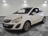 a picture of a small white car in a showroom