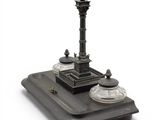 a miniature model of a clock tower on a tray