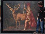 painting of a man standing next to a painting of a deer