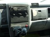 a dashboard of a car with a steering wheel and a radio