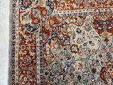 an image of a rug with a blue and red design on it