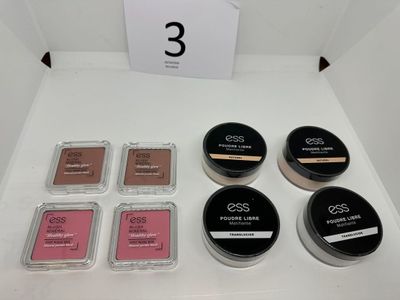 a white table topped with a box of makeup next to a sign