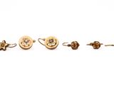 three pairs of gold earrings and a pair of ear rings