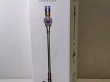 the box of the dysonon cordless vacuum is open on the table