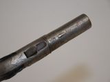 a close up of a gun that is on display