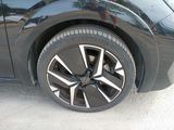 a close up of a car ' s wheel on the road