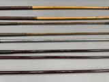 several different types of golf clubs are lined up on a table