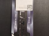a black and white picture of a cell phone in a package