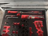 a tool box with tools in it on a table