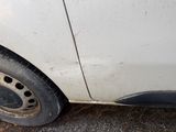 a white car that has a flat tire on it