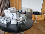 a table with a lot of plates and cups on it