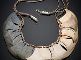 an image of a necklace made out of two pieces of horn horn