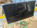 a television that is sitting on top of a cardboard box