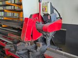 a machine that is working on a piece of metal