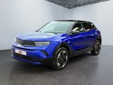 un SUV Volkswagen T-Cross bleu garé dans un showroom