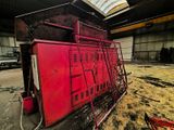 a red crate sitting in the middle of a building