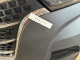 a close up of a car ' s grille with a sticker on it