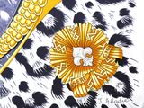 a picture of a painting of a bird on a leopard print background