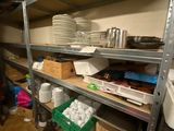 a room with a lot of shelves and dishes on it