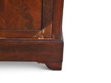 a small wooden cabinet with a door on top of it