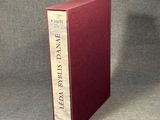 the book is sitting on a table with a gray background