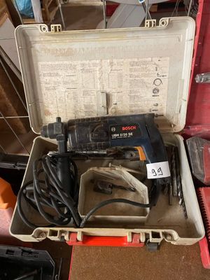 a tool box with a drill and other tools in it