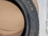 a close up of a tire on top of a cardboard box