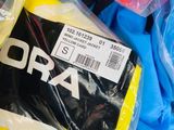 a pile of clothing that is wrapped in plastic