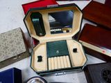 many different types of watches in a case on the floor