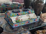 many vases and other decorative items on a glass table
