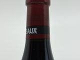 a bottle of wine that is sitting on a table