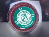a close up of a bottle of coffee on a table