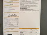 a picture of a receipt on a refrigerator door