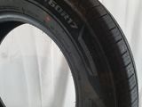 a close up of a tire on a white surface
