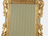a mirror on a stand with a mirror on it