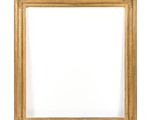 a gold picture frame on a white wall with a white background