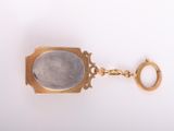 an image of a close up of a key chain on a white surface