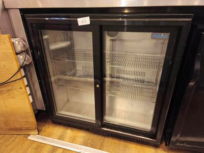 two glass doors that are open on the side of a refrigerator