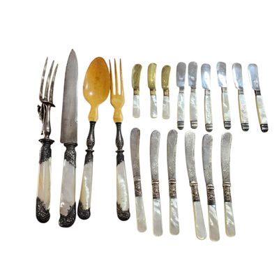 a lot of silver and silverware on a white background