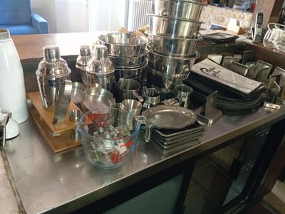 a table with a lot of dishes and cups on it