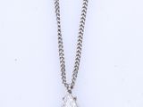 a diamond pendant on a chain on a white background