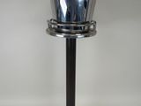stainless steel ice bucket on pedestal on white background