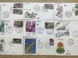 a lot of stamps on a table with stamps on them
