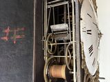 a clock that is hanging on the wall in the room