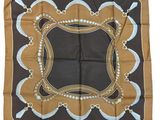 a brown and blue square scarf with a design on it