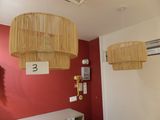 two lamps hanging from the ceiling in a room