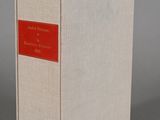 a white box with a red label sitting on top of a gray surface