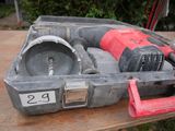 a tool box with tools on a table in the yard