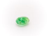 a green emerald gems on a white background