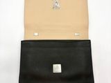 two black and tan leather wallets on a white background